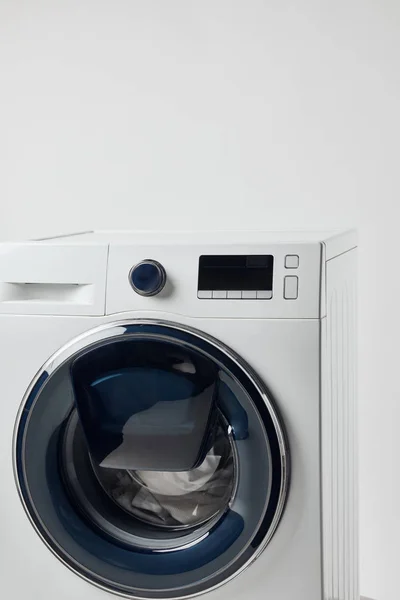 Modern washing machine with black display isolated on grey — Stock Photo