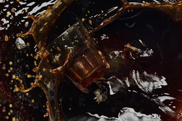 Overturned glass with black coffee, big splash and drops — Stock Photo