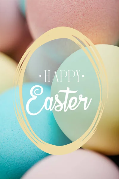 Close up of painted chicken eggs for Easter with happy Easter lettering — Stock Photo