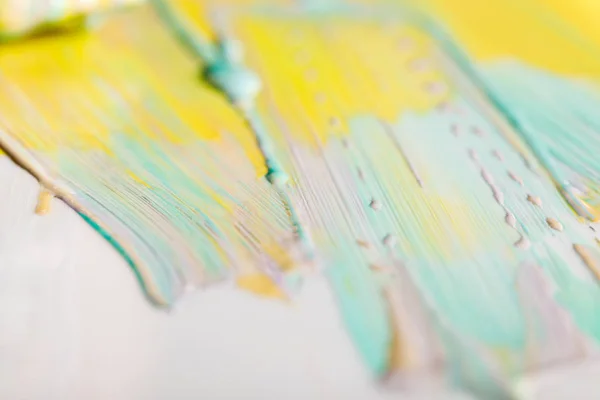 Selective focus of bright colorful brushstrokes on white surface — Stock Photo