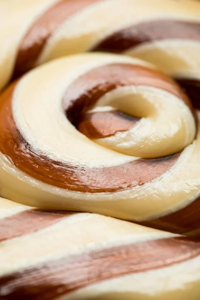 Close up view of swirl beige and brown tasty shiny sweet lollipop — Stock Photo