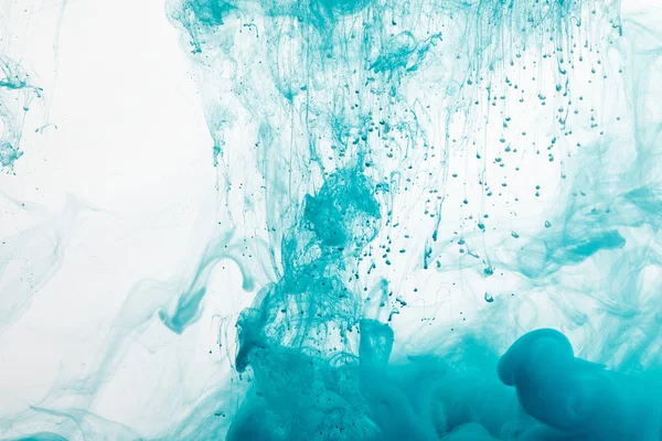 Close up view of blue paint splash in water — Stock Photo