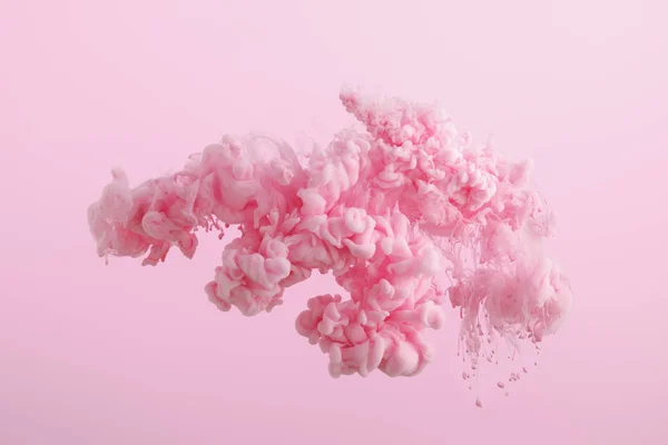 Pink paint splash in water isolated on pink — Stock Photo