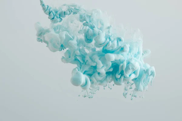 Close up of light blue paint splash isolated on grey — Stock Photo