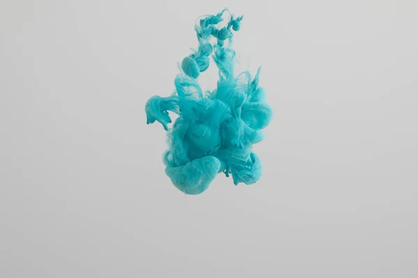 Turquoise paint swirls isolated on grey — Stock Photo