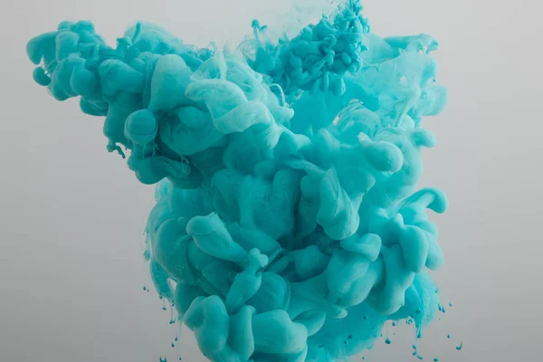 Turquoise paint splash isolated on grey — Stock Photo