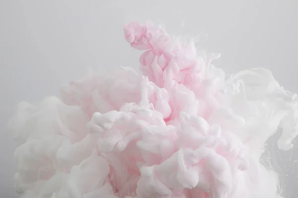 Close up view of light pink paint splash isolated on grey — Stock Photo