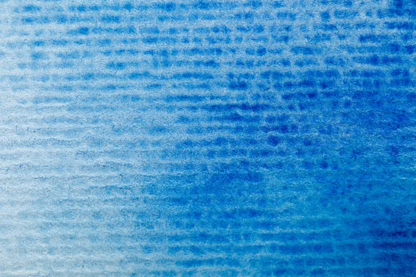 Close up view of blue watercolor paint on textured background — Stock Photo