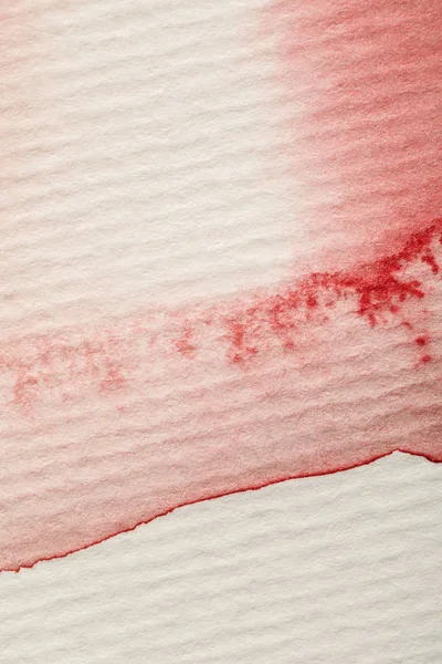 Close up view of yellow, blue and red watercolor paint spills on white background — Stock Photo
