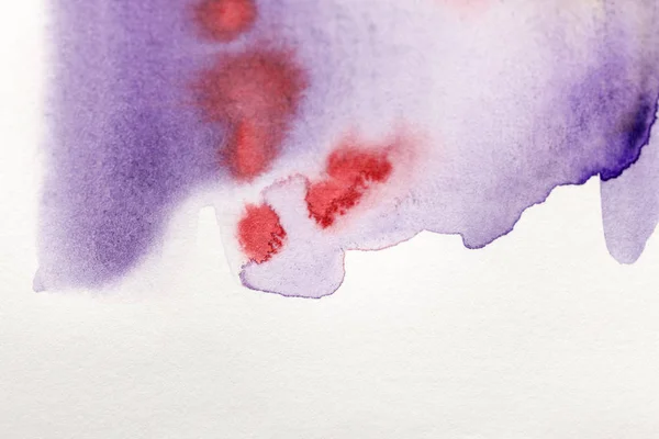 Purple and red watercolor paint spills on white background — Stock Photo