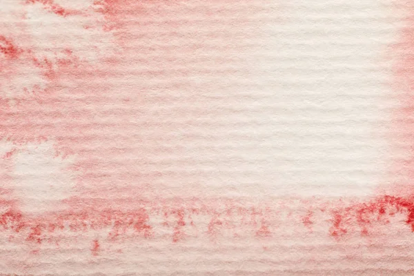 Red watercolor paint spill on textured background — Stock Photo