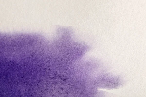 Purple colorful watercolor paint spill on white textured background with copy space — Stock Photo