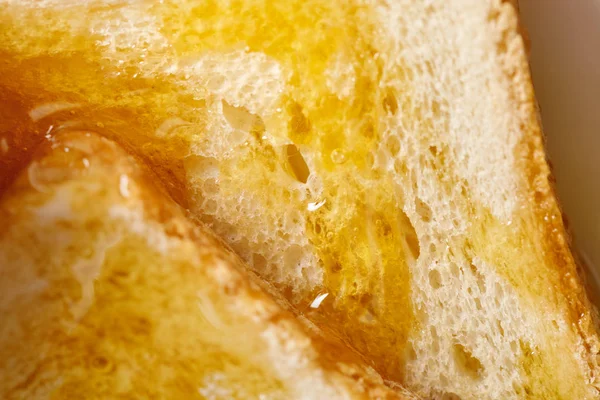 Nahaufnahme von Toasts mit Honig — Stockfoto