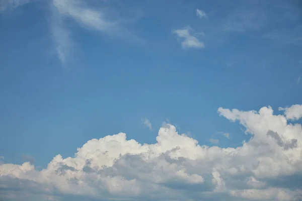 White clouds on bright blue sky with copy space — Stock Photo