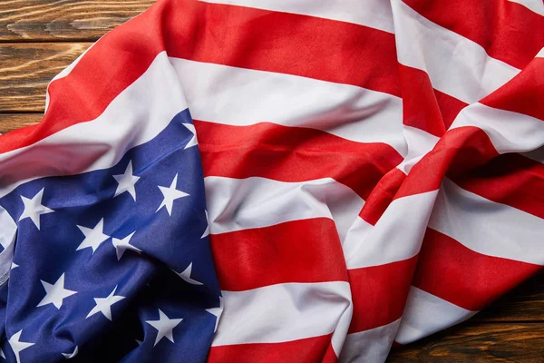 Top view of traditional american flag on wooden surface — Stock Photo