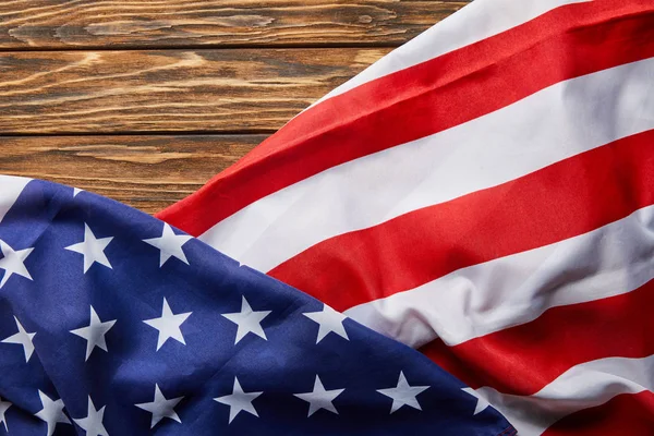 Top view of usa flag on wooden surface with copy space — Stock Photo