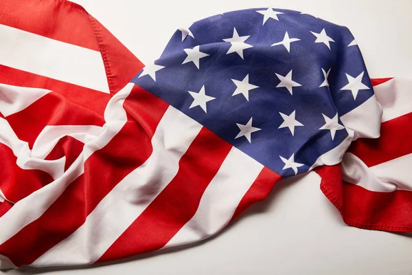 Top view of crumpled national american flag on white background — Stock Photo