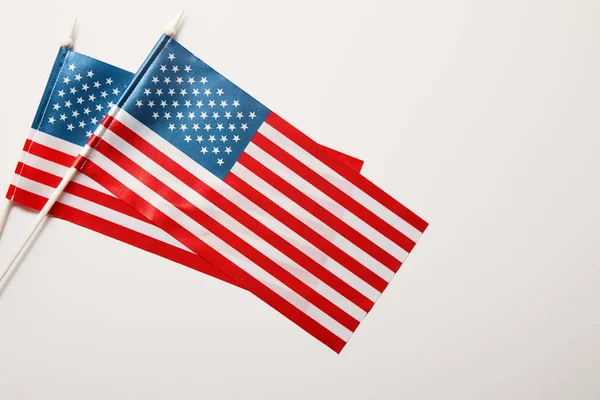 Top view of american flags on sticks on white background — Stock Photo