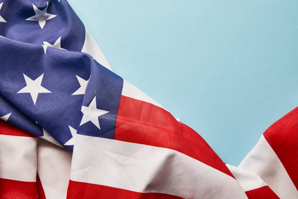 Close up view of american flag on blue background with copy space — Stock Photo
