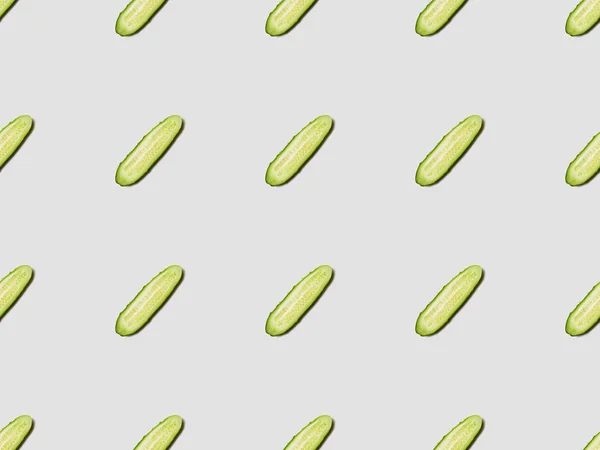 Top view of cucumber slices on white background, seamless pattern — Stock Photo