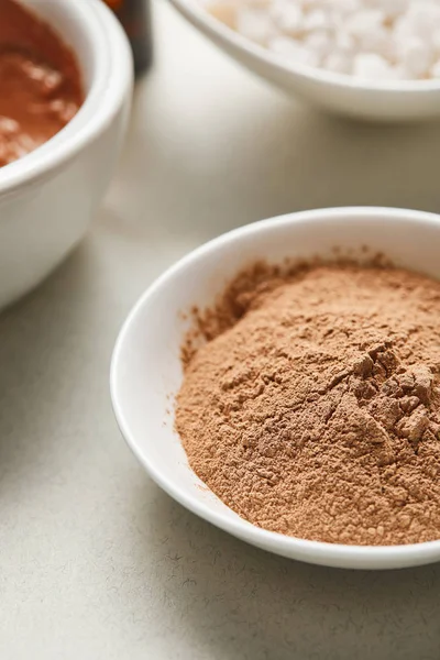 Close up view of brown clay powder in white bowl — Stock Photo