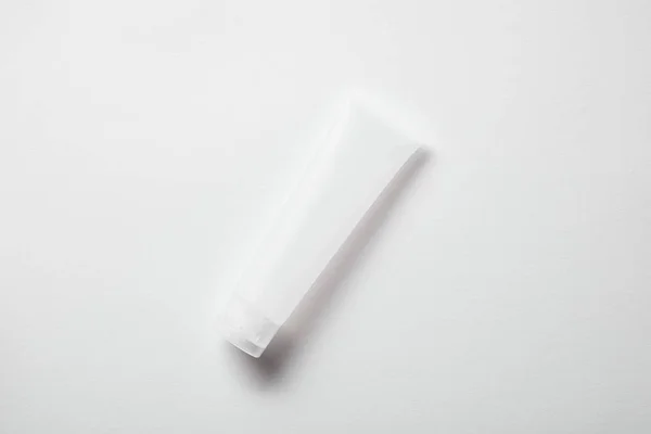 Top view of empty cream tube on white — Stock Photo