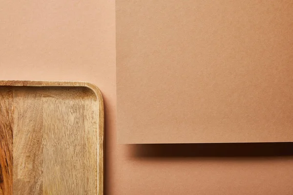 Top view of wooden tray and plywood on brown — Stock Photo