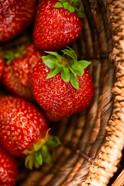 Close up of sweet red strawberries in wicker basket — Stock Photo