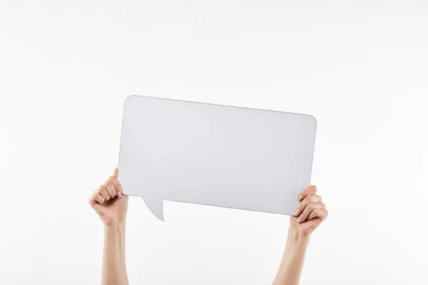 Cropped view of woman with speech bubble in hands isolated on white — Stock Photo