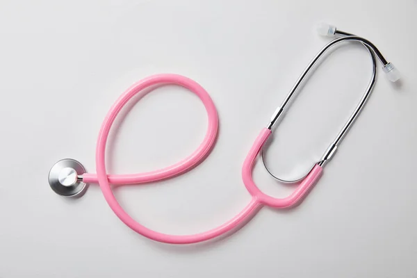 Top view of pink stethoscope on white — Stock Photo