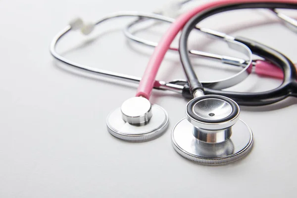 Close up view of two stethoscopes on white — Stock Photo