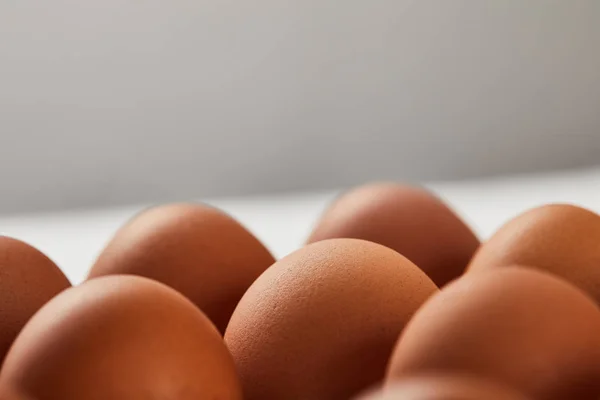 Selective focus of chicken eggs in carton box — Stock Photo