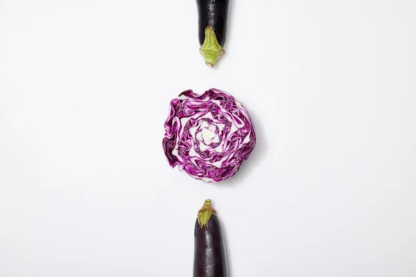 Top view of red cabbage and eggplants on white background — Stock Photo