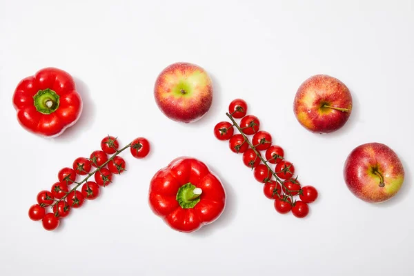 Top view of red apples and vegetables on white background — Stock Photo