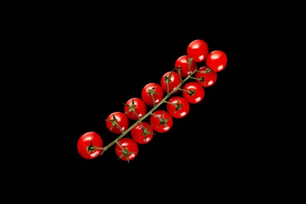 Top view of fresh organic cherry tomatoes isolated on black — Stock Photo