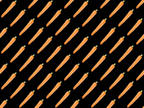 Organic carrots isolated on black, seamless background pattern — Stock Photo