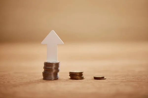 Increasing chart made of coins with white arrow, financial growth concept — Stock Photo