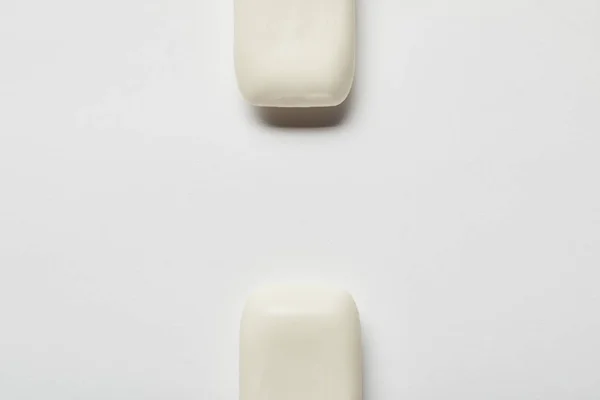 Top view of white soaps on grey background with copy space — Stock Photo