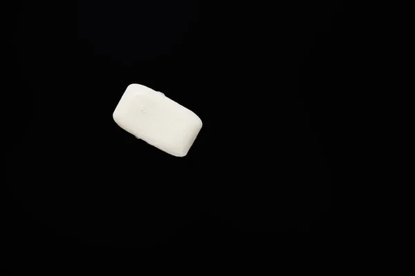 Top view of white soap isolated on black with copy space — Stock Photo