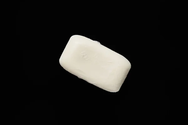 Top view of white soap isolated on black with copy space — Stock Photo