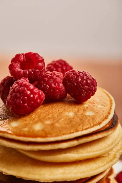 Close up view of pancakes with raspberries on wooden surface — Stock Photo