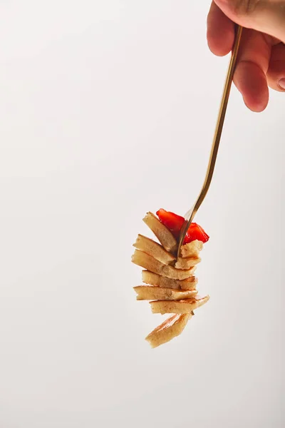 Cropped view of man taking slice of pancakes with strawberry — Stock Photo