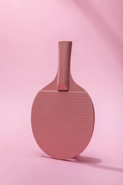 Table tennis racket on pink background with copy space — Stock Photo