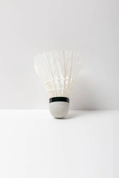 White badminton shuttlecock on white background with copy space — Stock Photo