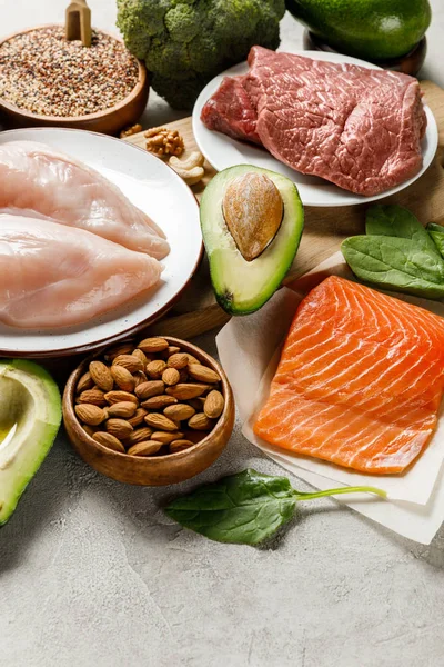 Fresh raw ketogenic diet ingredients on grey background — Stock Photo