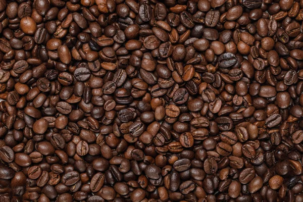 Vista superior de sabrosos granos de café con textura fresca - foto de stock