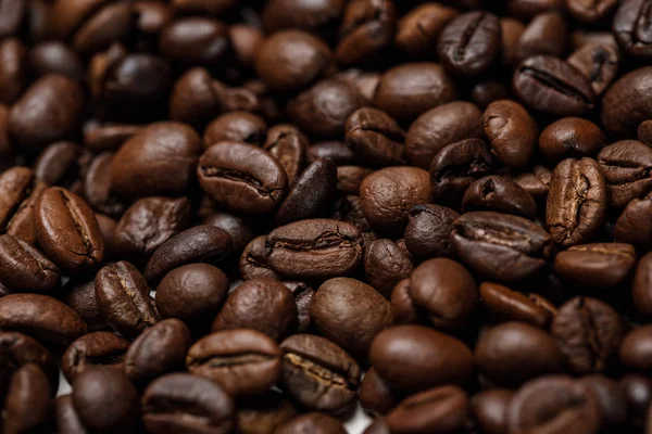 Close up view of delicious fresh textured coffee grains — Stock Photo