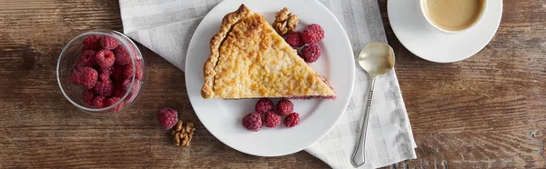 Top view of piece of pie and raspberries on wooden table, panoramic shot — Stock Photo
