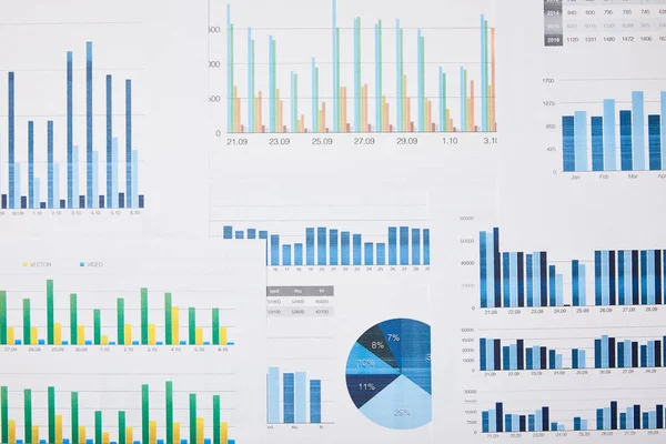 Top view of papers with charts and graphs on table — Stock Photo