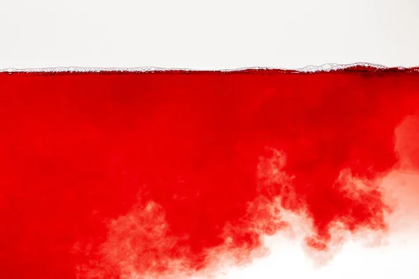 Abstract red cloud in liquid with bubbles on surface isolated on white — Stock Photo